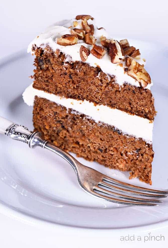Favorite Carrot Cake Recipe - Carrot Cake makes for a flavorful and delicious dessert! Made with grated carrots and other mix-ins, this is my favorite carrot cake recipe of all time! // addapinch.com