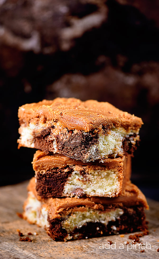 Chocolate Marble Squares makes a delicious cake recipe of marbled chocolate and yellow cake topped with homemade caramel icing! // addapinch.com