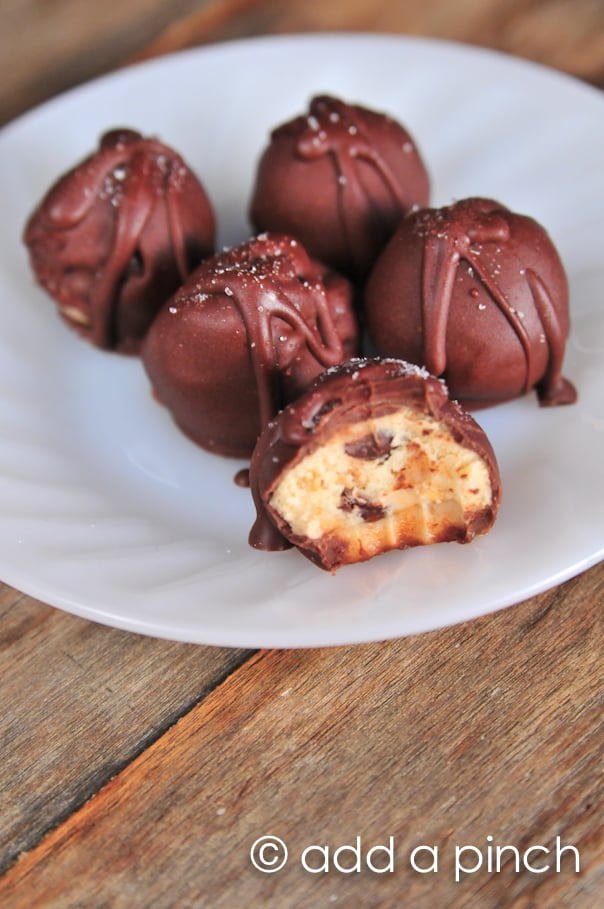 Cookie dough truffles on a white plate.