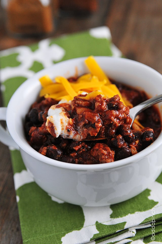 Black Bean Chili Recipe - Black Bean Chili is perfect for a quick-fix weeknight supper. Ready in 30 minutes, this chili is full of ground beef, black beans, and tons of flavor! // addapinch.com