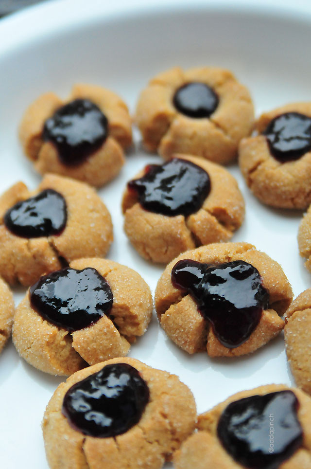 Peanut Butter and Jelly Thumbprint Cookies Recipe | addapinch.com