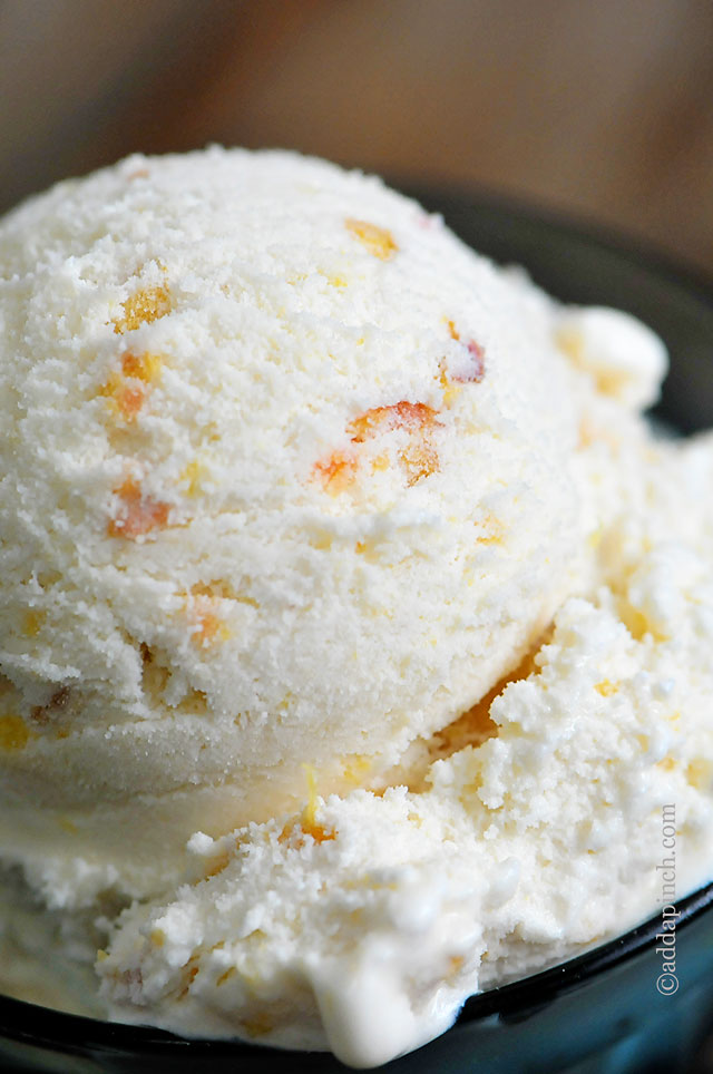 Closeup of large scoop of Peach Ice Cream | ©addapinch.com