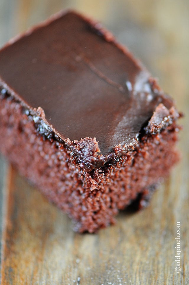 The Best Chocolate Cake with Fudge Icing | ©addapinch.com