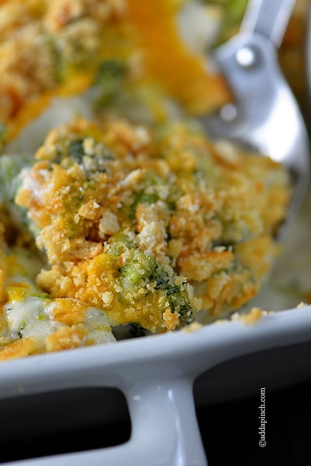 Closeup photo of Broccoli Cheese Casserole in white baking dish