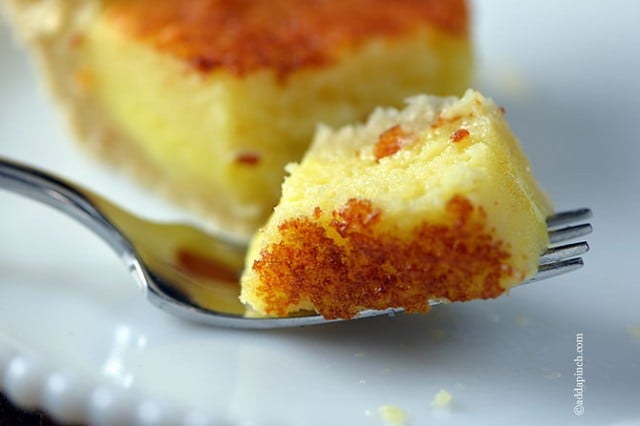 Bite of buttermilk pie on a fork. 