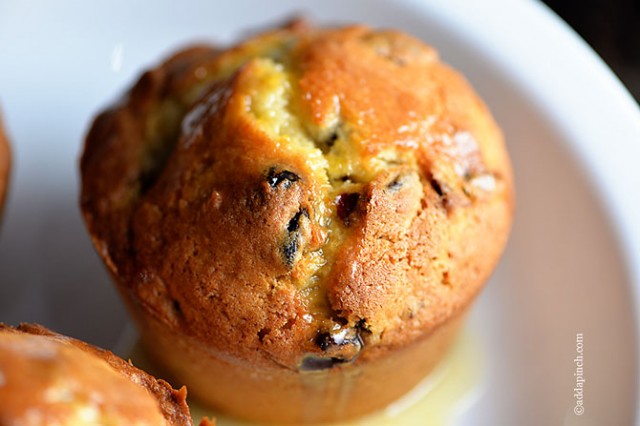 Cranberry Orange Muffins drizzled with sweet orange glaze.
