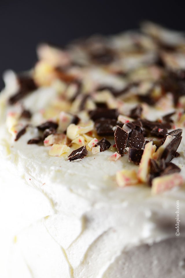 Closeup view of top of cake with crushed peppermint bark.