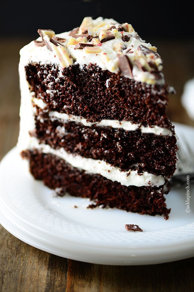 Slice of Peppermint Chocolate Cake on a white dessert plate.