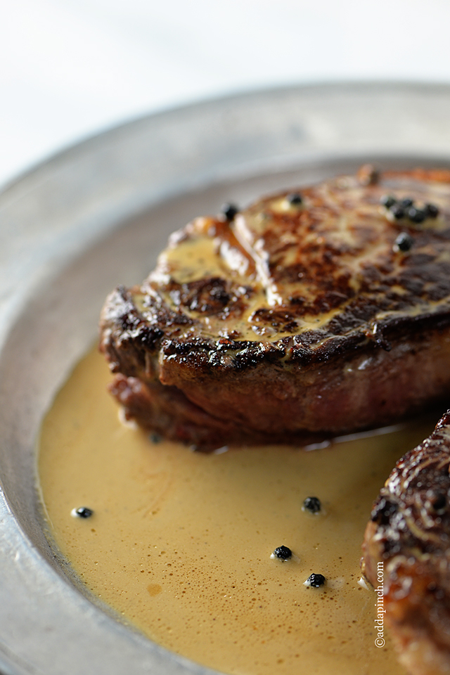 Steaks with Peppercorn Sauce Recipe | ©addapinch.com