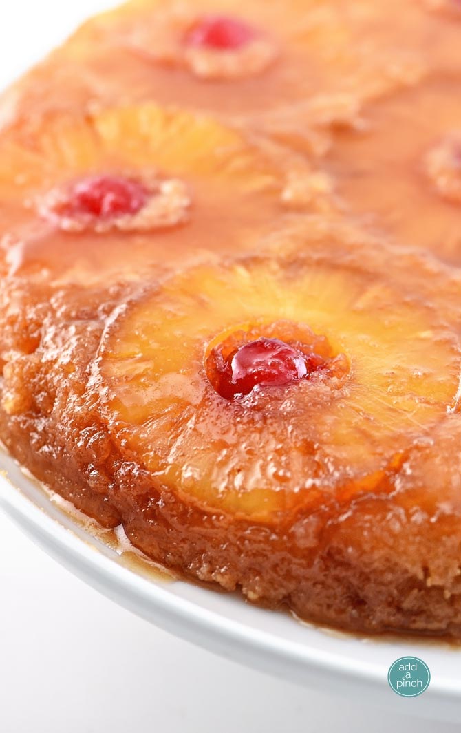 Pineapple Upside Down Cake makes a timeless dessert. Topped with a signature pineapple and cherry topping, this pineapple upside down cake is a southern classic. // addapinch.com