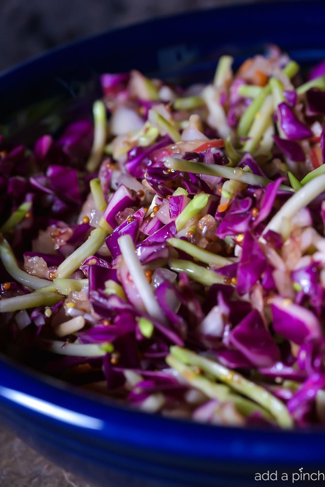 Asian Slaw Recipe. This Asian slaw recipe is quick, easy and so full of flavor. Perfect for a weeknight side dish or even when entertaining! // addapinch.com