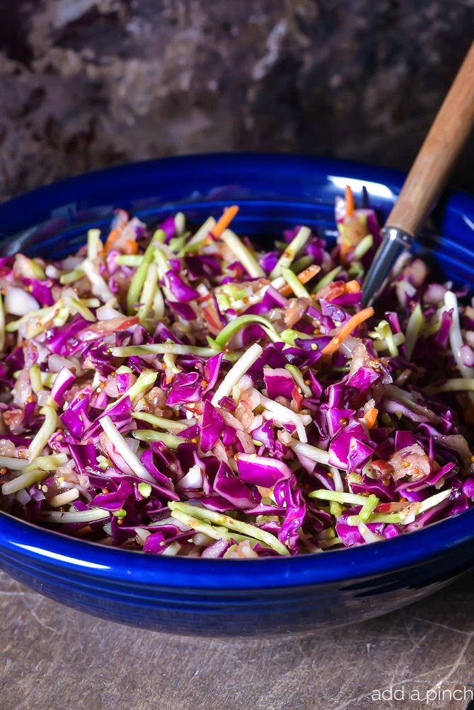 Asian Slaw Recipe. This Asian slaw recipe is quick, easy and so full of flavor. Perfect for a weeknight side dish or even when entertaining! // addapinch.com