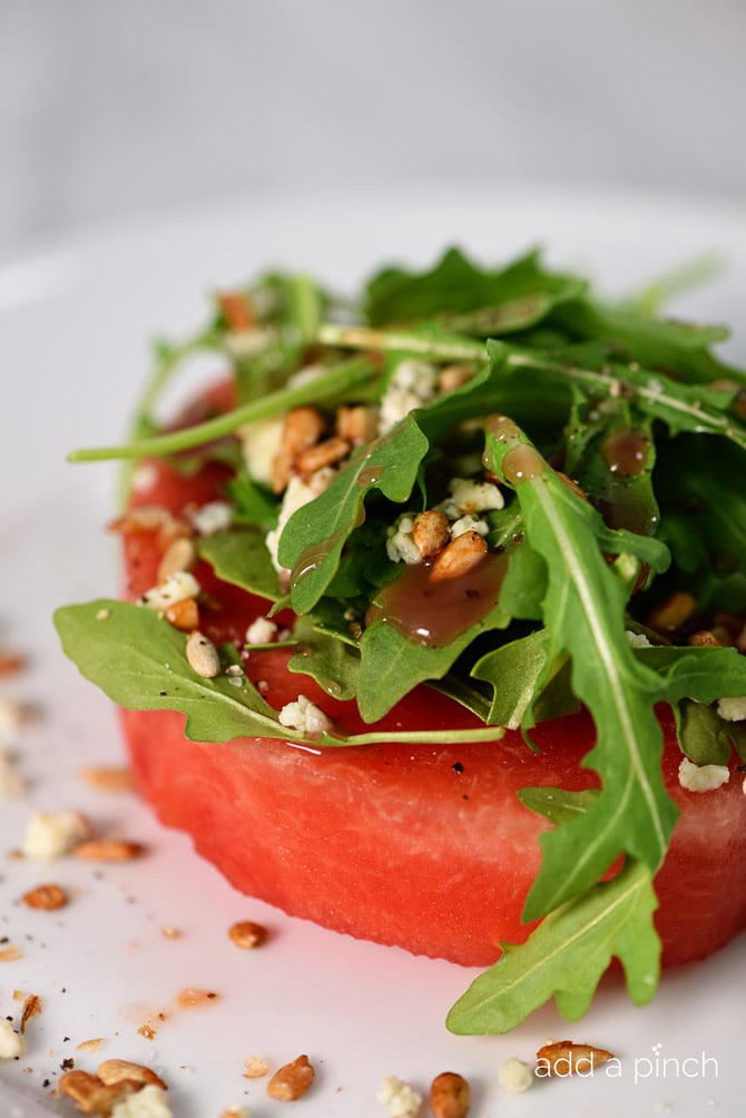 This watermelon salad is a welcome addition to your summer meals! Ready in minutes, it makes a warm weather favorite! // addapinch.com