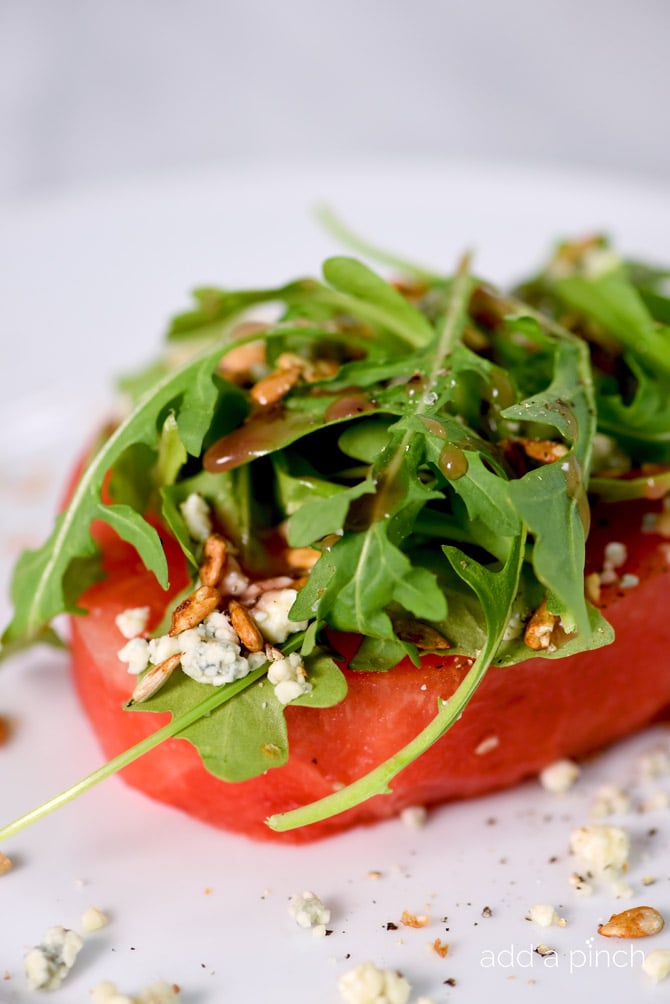 This watermelon salad is a welcome addition to your summer meals! Ready in minutes, it makes a warm weather favorite! // addapinch.com