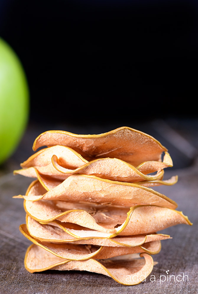 Baked apple chips are so simple to make at home! Crispy and delicious, these apple chips are addictive! // addapinch.com
