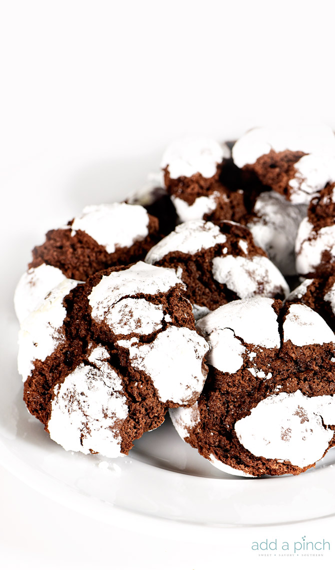 Chocolate Crinkle Cookies Recipe - Chocolate crinkle cookies coated in powdered sugar and baked into a soft, chewy, delicious chocolate cookie! What's not to love! // addapinch.com