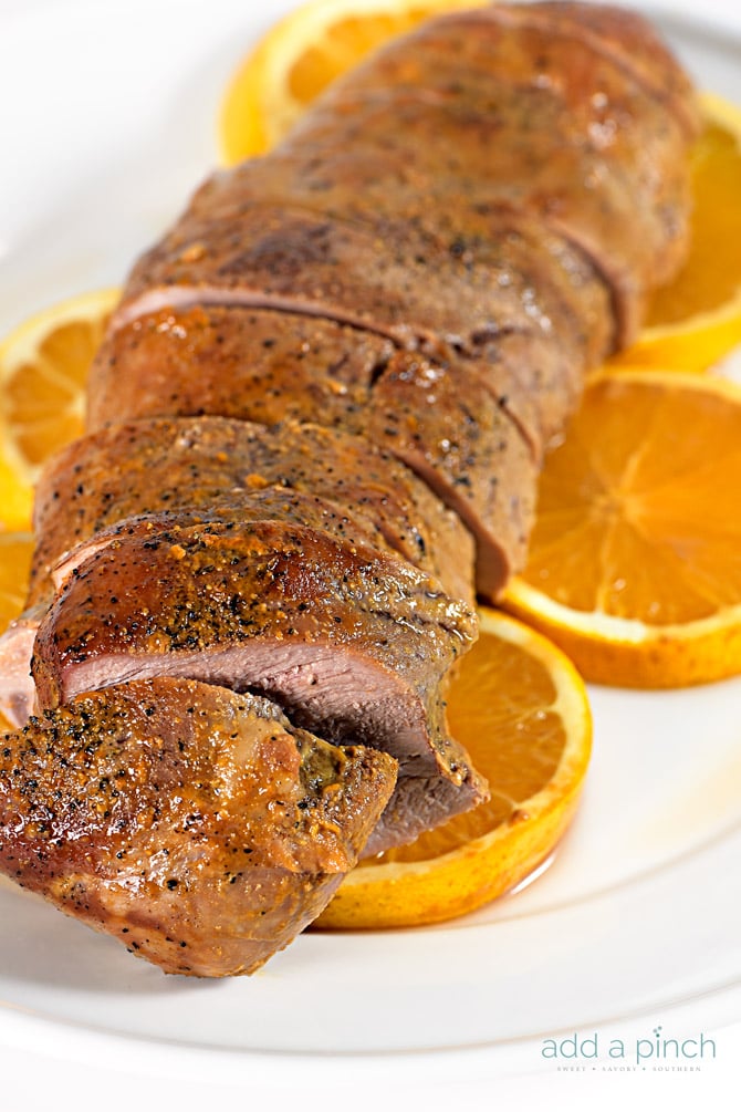 Orange Teriyaki Pork Tenderloin Recipe - This simple orange teriyaki pork tenderloin makes a quick and easy weeknight meal that is also delicious for special occasions. // addapinch.com