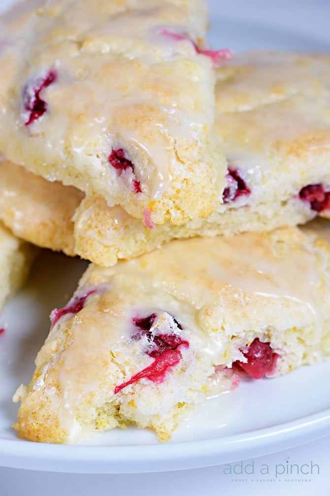 Cranberry Orange Scones make a quick and easy scone recipe perfect for breakfast or brunch. A delicious combination of sweet and tart! // addapinch.com