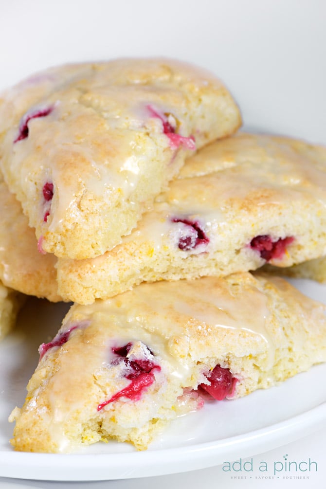 Cranberry Orange Scones make a quick and easy scone recipe perfect for breakfast or brunch. A delicious combination of sweet and tart! // addapinch.com