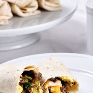 Make-Ahead Breakfast Burritos Recipe - Stock your freezer with these easy make-ahead breakfast burritos for even easier mornings! // addapinch.com