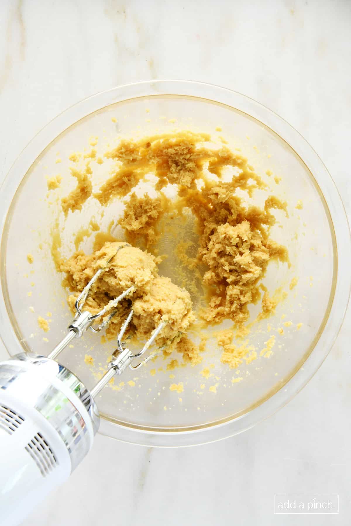 Photo of brown sugar and butter creamed together in a glass bowl