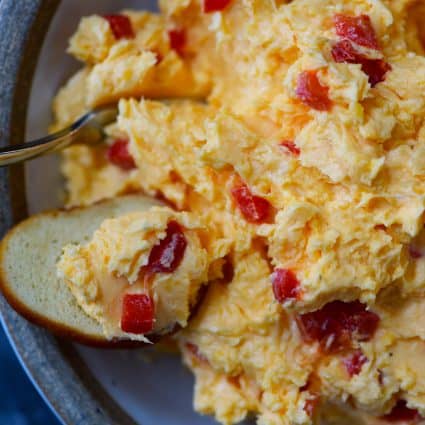 Pimento cheese scooped onto a bagel chip.