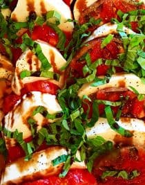 Caprese Salad with Balsamic Glaze Recipe - A classic caprese salad recipe with out of this world flavor. Topped with a sweet, yet tangy balsamic glaze to elevate every single bite! // addapinch.com