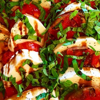 Caprese Salad with Balsamic Glaze Recipe - A classic caprese salad recipe with out of this world flavor. Topped with a sweet, yet tangy balsamic glaze to elevate every single bite! // addapinch.com