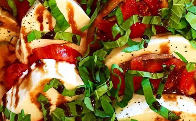 Caprese Salad with Balsamic Glaze Recipe - A classic caprese salad recipe with out of this world flavor. Topped with a sweet, yet tangy balsamic glaze to elevate every single bite! // addapinch.com