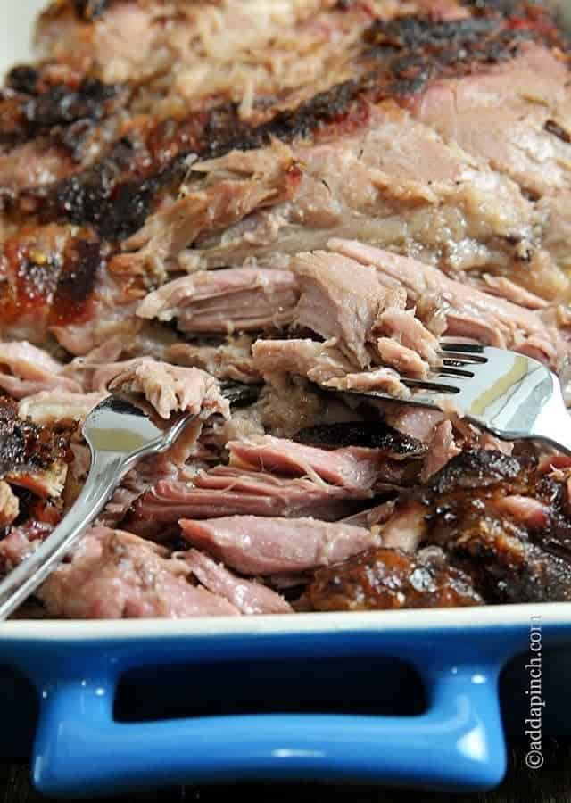Easy pulled pork recipe that lets your slow cooker do all the work. Get this simple slow cooker pulled pork recipe everyone will love! // addapinch.com
