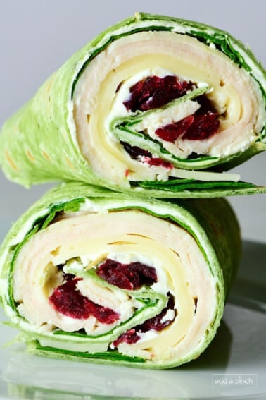 Turkey wrap with dried cranberries in a spinach wrap.