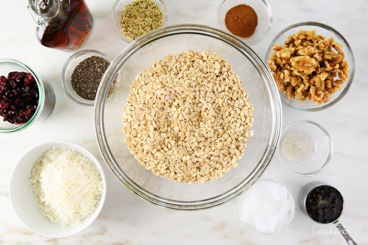 Ingredients used to make homemade granola on a marble surface. 