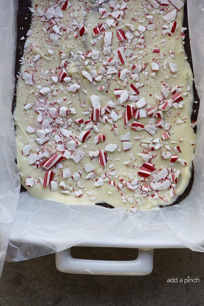 Peppermint Bark spread onto wax paper lined dish 