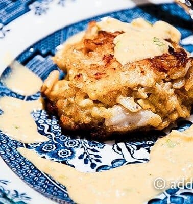 Crab Cakes Recipe - Crab cakes with remoulade sauce makes for a wonderful appetizer for a special occasion dinner or even a main dish attraction served with a salad or vegetables. // addapinch.com