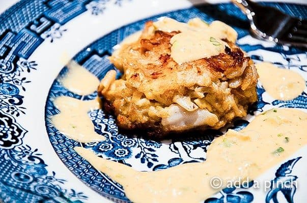 Crab Cakes Recipe - Crab cakes with remoulade sauce makes for a wonderful appetizer for a special occasion dinner or even a main dish attraction served with a salad or vegetables. // addapinch.com