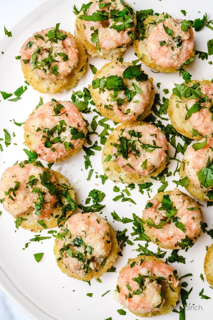 Shrimp and Grits Bites are a bite-sized version of the all-time favorite shrimp and grits. Made in a mini muffin tin and perfectly portioned for entertaining, parties, tailgates and more! // addapinch.com