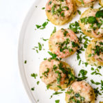 Shrimp and Grits Bites are a bite-sized version of the all-time favorite shrimp and grits. Made in a mini muffin tin and perfectly portioned for entertaining, parties, tailgates and more! // addapinch.com