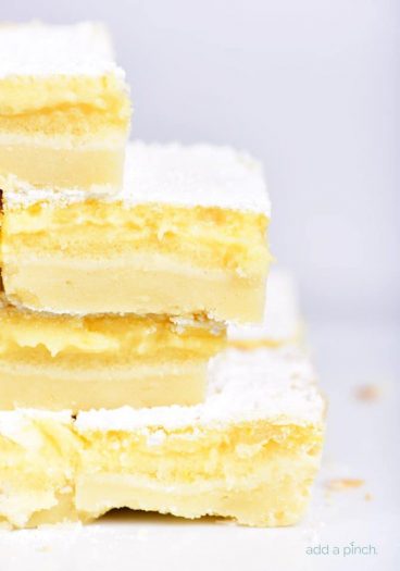 Easy Lemon Bars Recipe - This easy Lemon Bars recipe makes a delicious sweet treat! Layered onto a shortbread crust, this tart, yet sweet lemon bar is perfect for the lemon lover! // addapinch.com