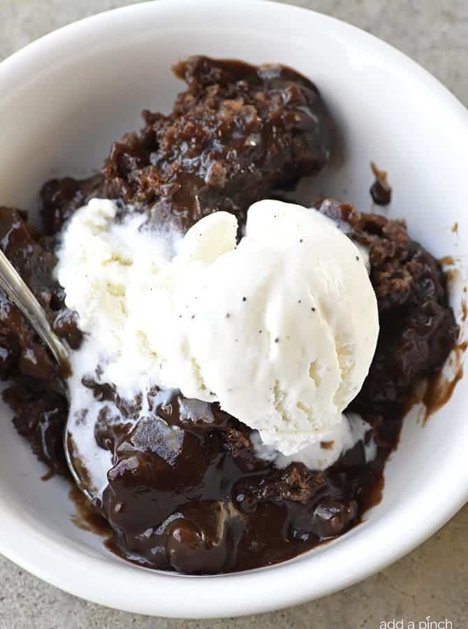 Southern Chocolate Cobbler Recipe - Chocolate Cobbler is a classic Southern dessert recipe. With a delicious brownie-like topping and a rich fudge sauce on the bottom, this Chocolate Cobbler is like a lava cake but so much easier to make. Great for reunions, potlucks, and more! // addapinch.com
