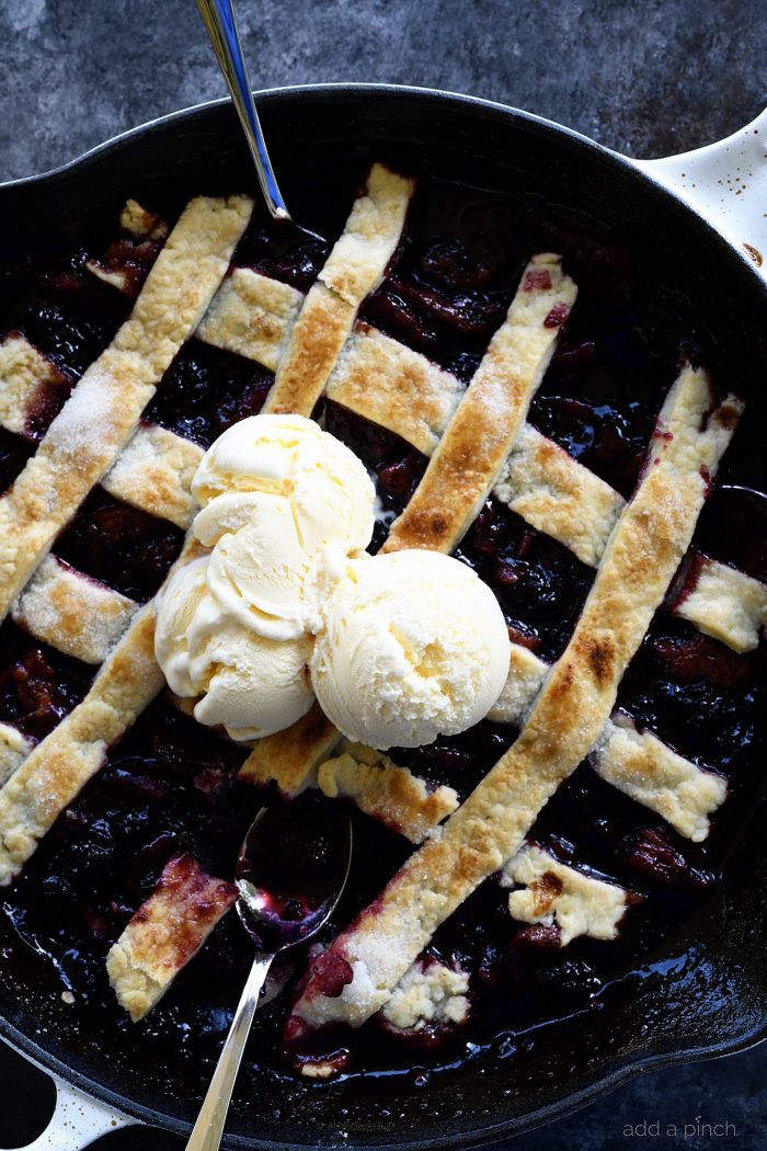 Southern Blackberry Cobbler Recipe - This blackberry cobbler makes a classic dessert. Including a lattice top and pastry dumplings, this blackberry cobbler is a favorite. // addapinch.com