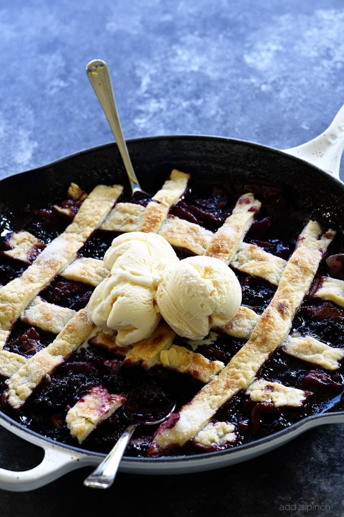 Southern Blackberry Cobbler Recipe - This blackberry cobbler makes a classic dessert. Including a lattice top and pastry dumplings, this blackberry cobbler is a favorite. // addapinch.com
