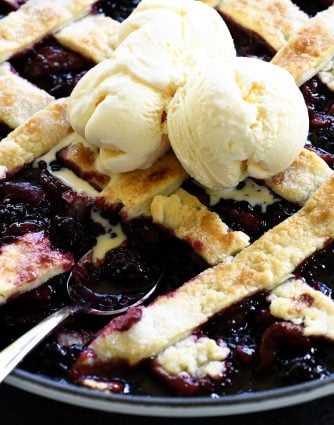 Southern Blackberry Cobbler Recipe - This blackberry cobbler makes a classic dessert. Including a lattice top and pastry dumplings, this blackberry cobbler is a favorite. // addapinch.com