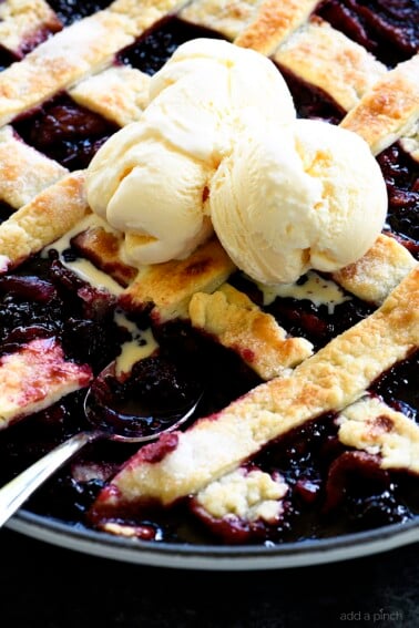 Southern Blackberry Cobbler Recipe - This blackberry cobbler makes a classic dessert. Including a lattice top and pastry dumplings, this blackberry cobbler is a favorite. // addapinch.com