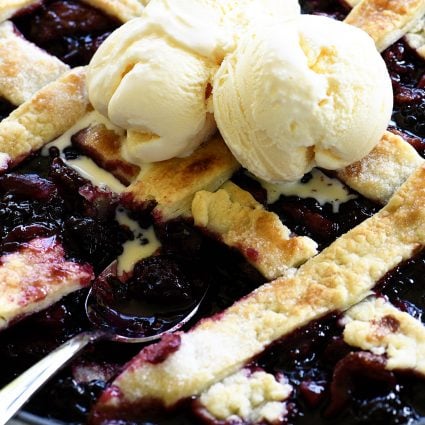 Southern Blackberry Cobbler Recipe - This blackberry cobbler makes a classic dessert. Including a lattice top and pastry dumplings, this blackberry cobbler is a favorite. // addapinch.com