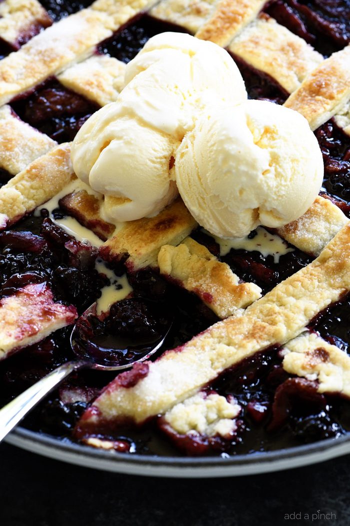 Southern Blackberry Cobbler Recipe - This blackberry cobbler makes a classic dessert. Including a lattice top and pastry dumplings, this blackberry cobbler is a favorite. // addapinch.com