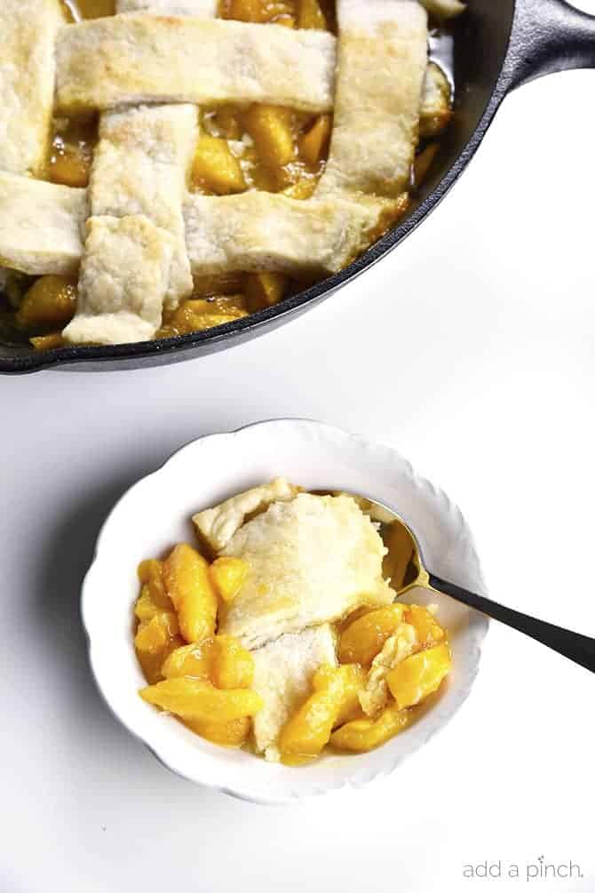 Old Fashioned Southern Peach Cobbler Recipe - Peach Cobbler Recipe – My Grandmother’s peach cobbler recipe is a traditional Southern peach cobbler! This heirloom recipe makes the best peach cobbler that has always been a staple in my family for generations. // addapinch.com