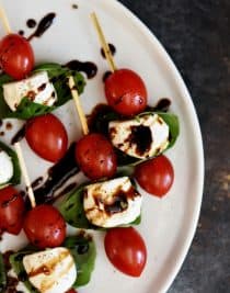 Caprese Salad Skewers Recipe - Caprese Salad Skewers make a delicious appetizer to serve when entertaining. Fresh and easy, these caprese salad skewers will become a go-to favorite! // addapinch.com