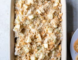 Hot chicken salad in baking dish with cracker and butter topping added.