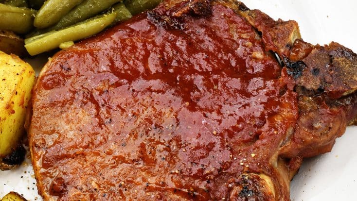 Slow Cooker BBQ Pork Chops - The slow cooker makes these pork chops fork tender and a family favorite! Just 5 minutes of prep time make this a favorite weeknight meal! // addapinch.com