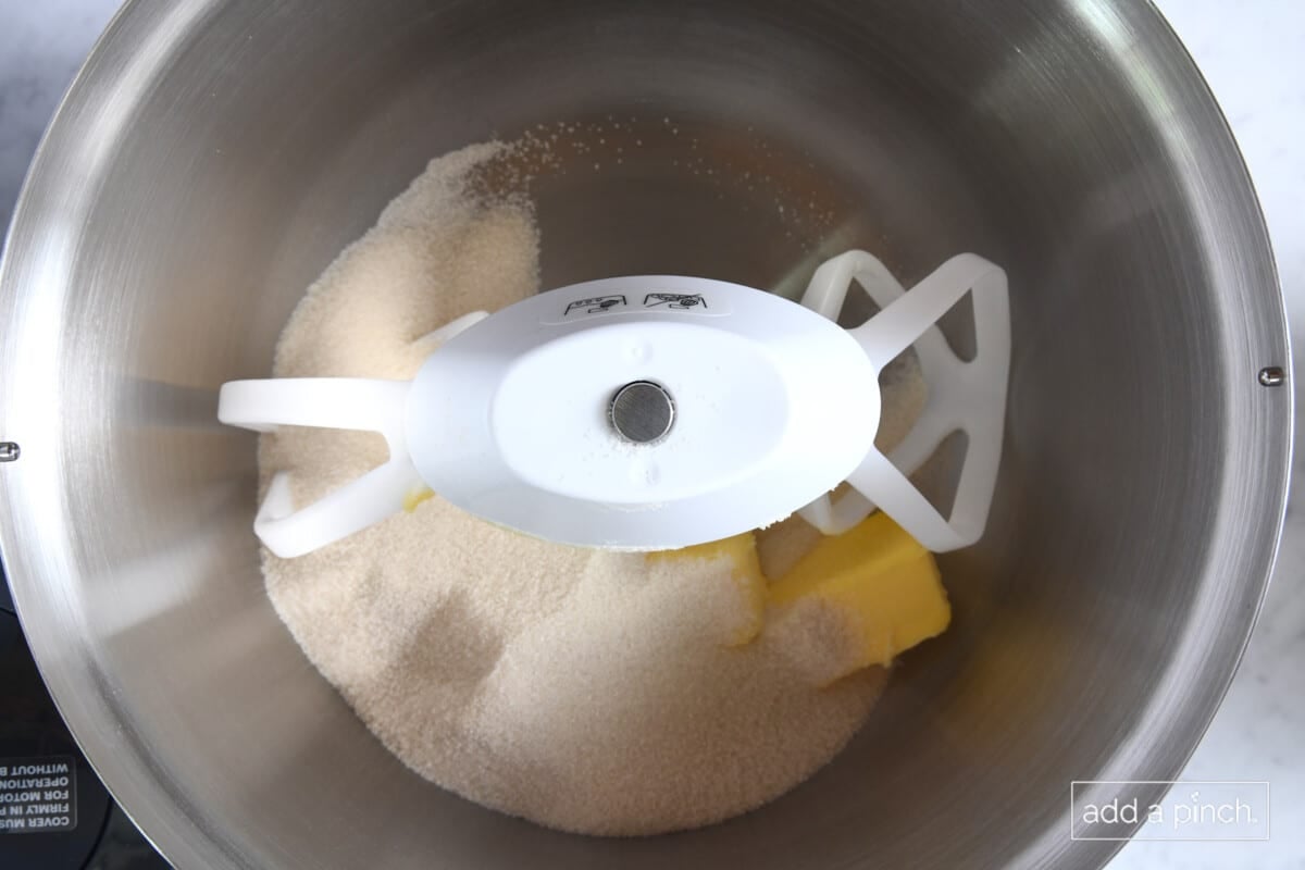Butter and sugar in a mixer bowl.